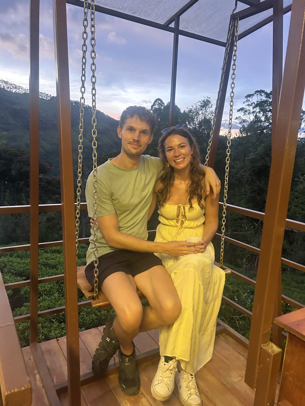Mike and Pip on a swing above the hills